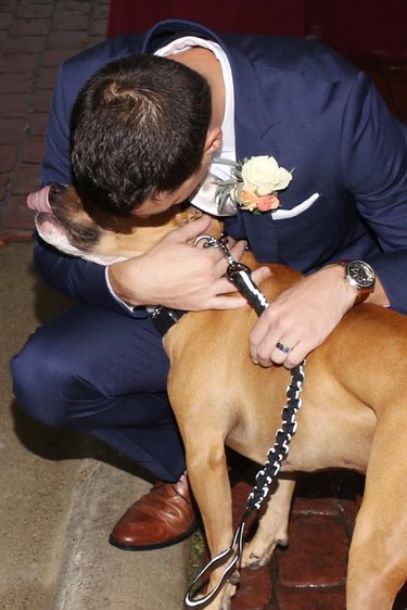 groom surprised by dog at wedding