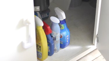 Household chemical cleaners in a cabinet