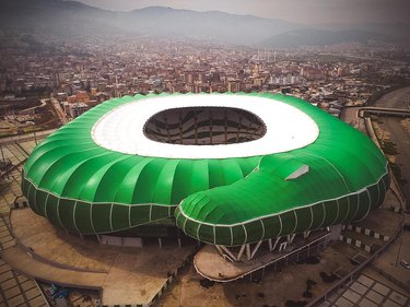 stadium shaped like a crocodile but also resembles coiled snek