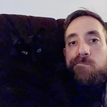 selfie with black cat foiled by black couch