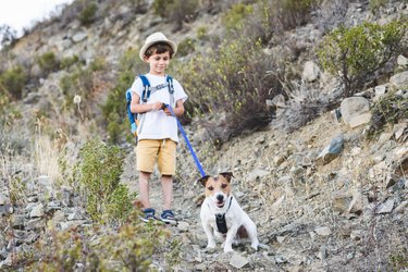 Kid with pet hiking by dog friendly trails in Cyprus mountains