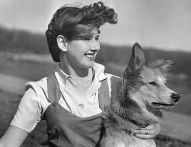 Young girl and dog in black and white photo