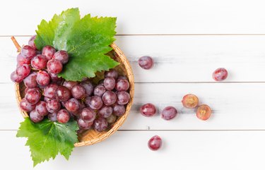 fresh grape on bamboo basket.