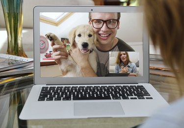 Guy showing off his new puppy over Skype.