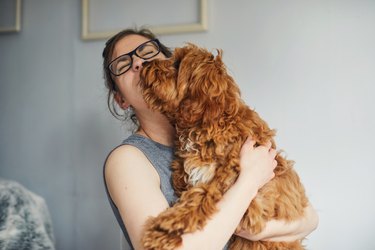 Woman holding her pet dog