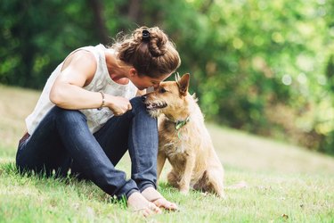 Adult Woman Enjoying Time with Pet Dog