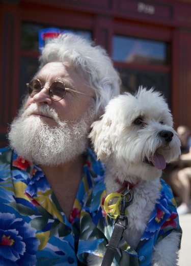 Senior man with look alike dog.