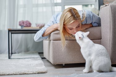 Friendly woman showing love to her cat