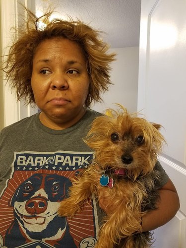 woman and dog are bedhead twins