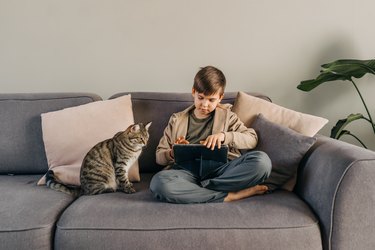 boy playing with digital tablet