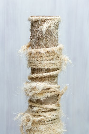 old cat tree, used scratching post with torn ropes