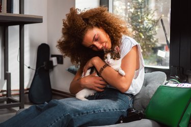 Cat lover holding cat