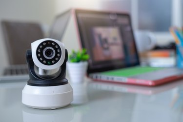 Close-Up of Ip camera on the table, online working form home, Camera or CCTV