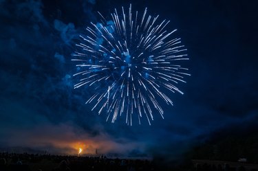 large blue firework in the sky