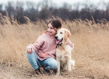 Beautiful girl with dog outside