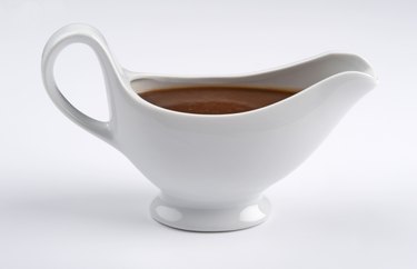 White china gravy boat on white background