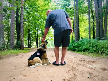 Dog and owner outdoors.