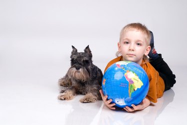 the boy, globe and a dog