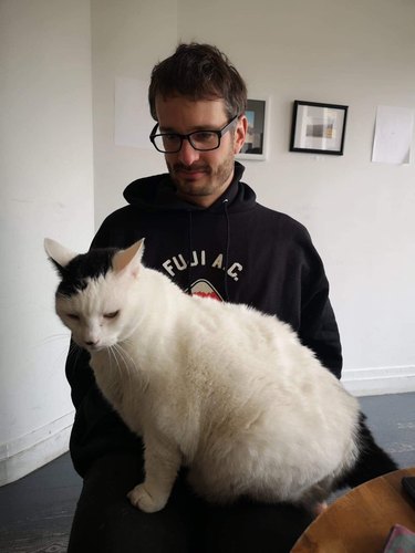 man meets chonky cat