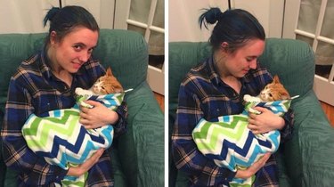 woman cradles cat like baby