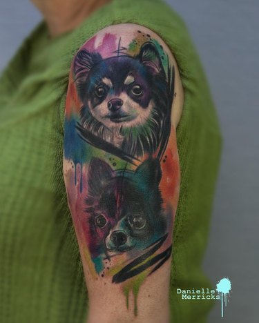 A dog tattoo that looks like a watercolor painting.