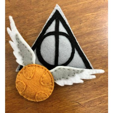 A handmade Deathly Hallows and Golden Snitch Catnip Toy Set