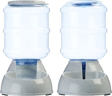 Two gravity feeders, one for food and one for water with clear plastic resevoirs.
