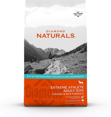 Bag of Diamond Naturals Extreme Athlete Adult Dog dry food. Bag reads "chicken and rice formula."