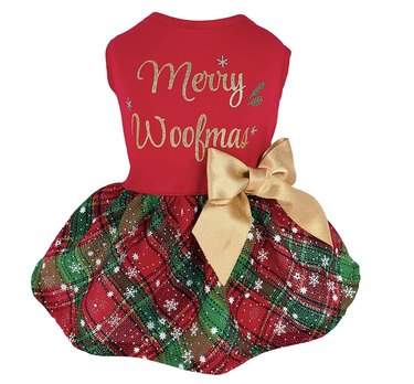 Red and green dog dress that says "Merry Woofmas" on the shirt, has a gold bow, and a plaid red and green skirt with snowflakes scattered across it.