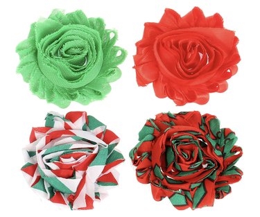 Four Christmas flower bows that can be attached to your dog's existing collar.