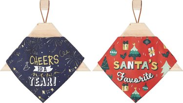 A reversible dog bandana with Santa's Favorite on one side and Cheers to a New Year on the other.