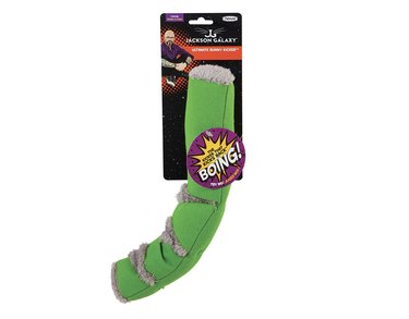 Green curved kicker toy for cats with gray fuzzy bits.