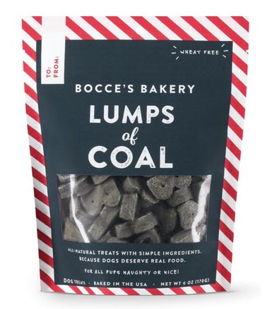 Coal-shaped dog treats in a striped red and white pouch.