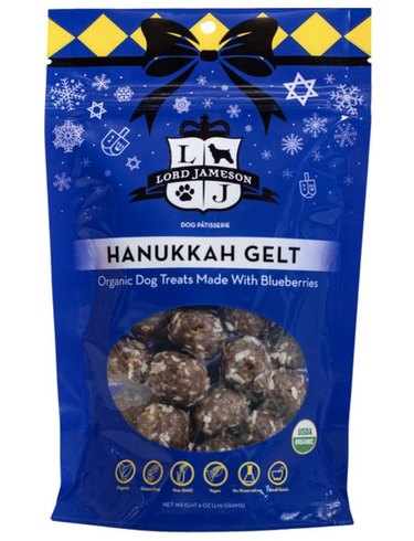 Hanukkah gelt for dogs in blue packaging with a see-through window so you can look at the goodies inside.