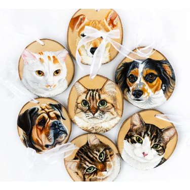 Wood ornaments with dogs and cat portraits on them