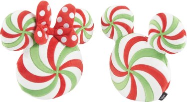 Green, white, and red peppermint-shaped plush dog toys with Minnie and Mickey Mouse ears.