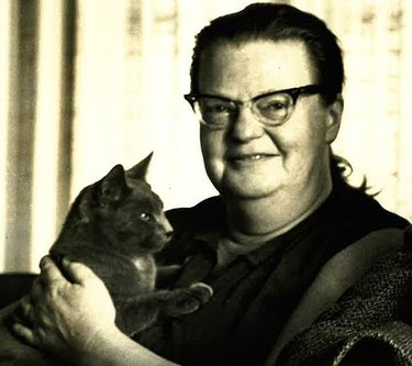 black cat psing with Shirley Jackson.