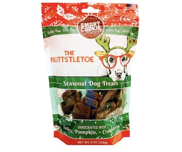 A bag of Muttstletoe Holiday Dog Treats that are Turkey & Pumpkin flavored.