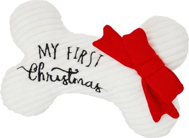 My First Christmas bone-shaped dog chew toy with red bow.