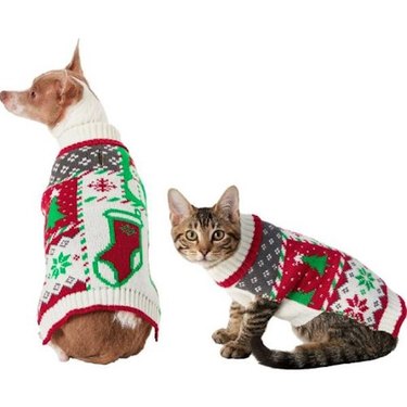 A dog and a cat wearing Frisco Grandma's Holiday Patchwork Dog & Cat Christmas Sweaters