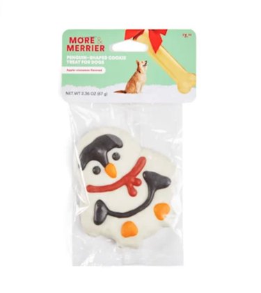 Holiday penguin-shaped frosted cookie for dogs, with red scarf.
