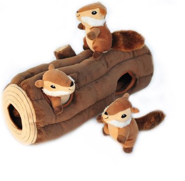 Plush squirrels hiding in a plush log