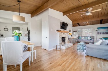 Great room with hardwood floors and dining area in San Clemente cottage.