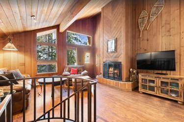 The wood-paneled living room area at Grizzly Den in Ptarmigan Village on Big Mountain