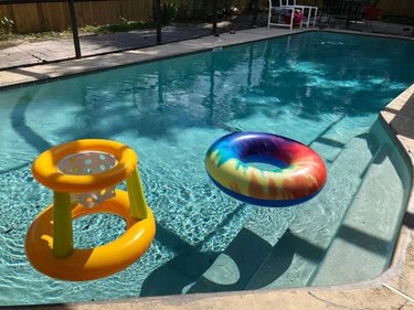 Swimming pool with floating inner tube and pool toy in Orlando, FL.