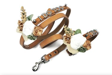 Wedding dog leash that says 'I Do Too' in rhinestones and features floral adornments.