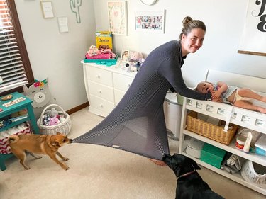 dog pull on woman's dress