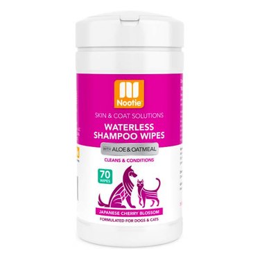 A container of Nootie Japanese Cherry Blossom Dog & Cat Waterless Shampoo Wipes. There's a flip-top that allows you to pull and separate the wipes.