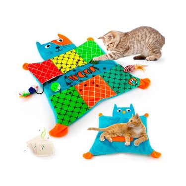 A striped cat playing with an AWOOF Cat Mat, and an orange cat laying on the revsersable blanket side of the mat