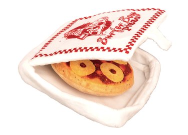 Stranger Things pizza toy. The box has the Surfer Boy Pizza logo on it and the pizza inside is topped with pineapple rings.